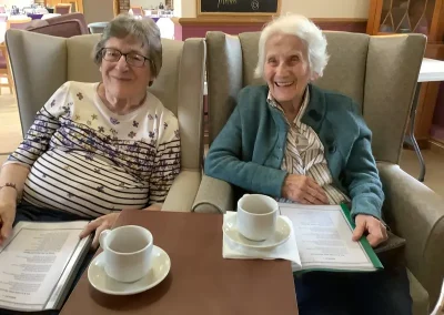 Residents relaxing and enjoing a cup of tea at Rose Cottage in Huntingdon, Cambridgeshire